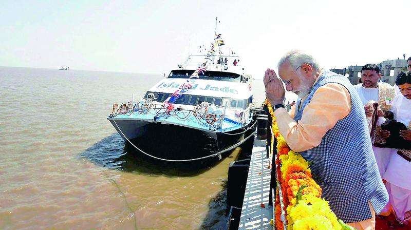 Prime Minister Narendra Modi performing Poojan at Ghogha Sea Ferry Point to mark the launch of Ghogha-Dahej Ro-Ro ferry service in Gujarat on Sunday. (Photo: PTI)