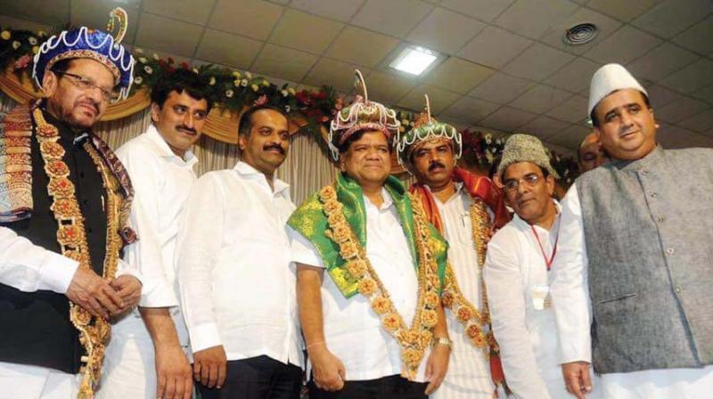 A file photo of BJP leaders Chandre Gowda, Jagadish Shettar and R. Ashok wearing the Tipu turban at a  function a few years ago.