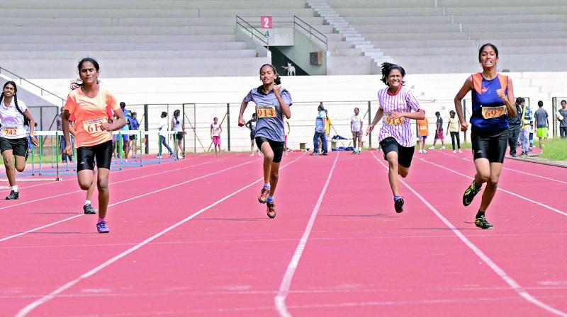 Action from the Girls Under-16 100 metres final at the Junior Athletic meet for Boys and Girls of U-14 & U-16 held at GMC Balayogi Stadium in Gachibowli, Hyderabad.