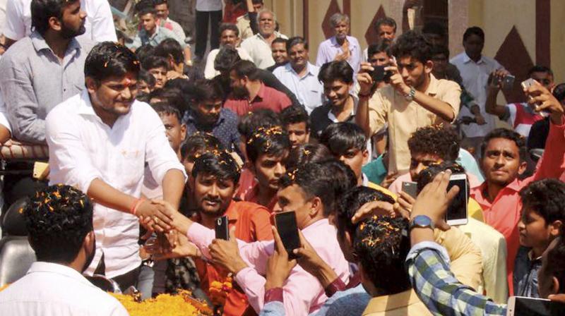 PAAS convener Hardik Patel meets his supporters at Bhavnagar district of Gujarat on Saturday. (Photo: PTI)