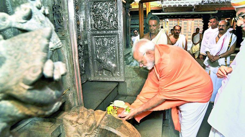 Prime Minister Narendra Modi offers prayers at Shri Manjunatha Swamy Temple at Dharmasthala in Karnataka on Sunday. (Photo: PTI)