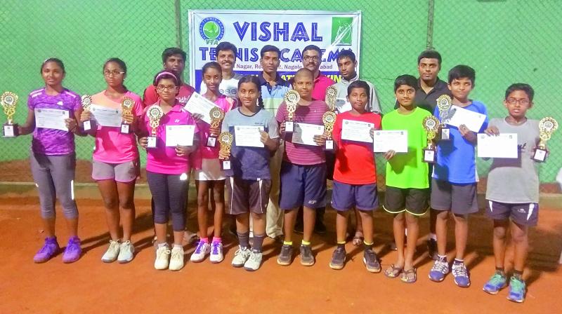 The winners and runners-up pose with trophies and certificates secured in the TSTA Ranking tournament played at Vishal Tennis Academy at Nagole in Hyderabad.