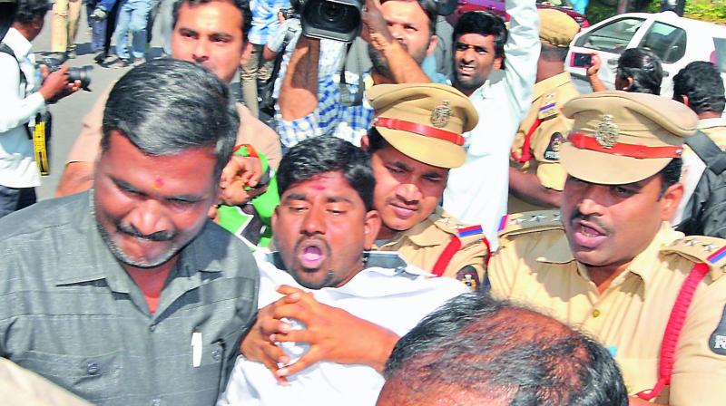 Police detains a  BJP Yuva Morcha activist during a Chalo Assembly protest demanding jobs, in Hyderabad on Tuesday. (Photo: DC)