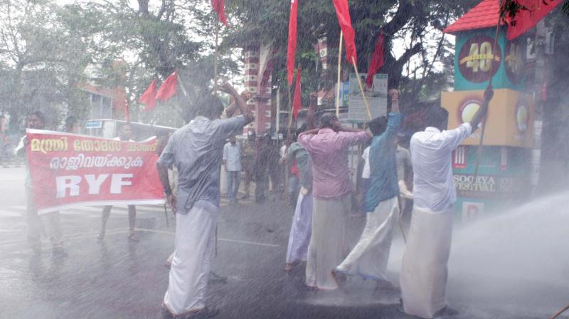 Police uses water cannons on RYF activists during their protest march demanding the ouster of Transport Minister Thomas Chandy in Thiruvananthapuram on Friday.  (Photo: A.V. MUZAFAR)