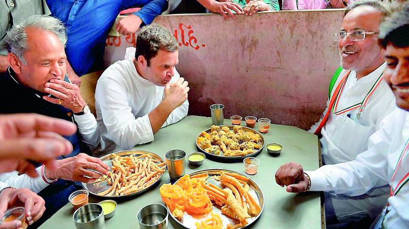 Congress vice-president Rahul Gandhi having breakfast at Chandrala, in Gandhinagar on Saturday. (Photo: PTI)