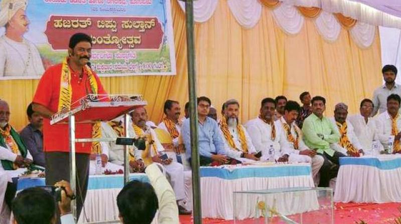 BJP MLA Anand Singh speaks at Tipu Jayanti celebrations in his home constituency at Hosapete on Friday.