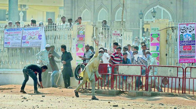 A file picture of stone-pelters creating ruckus near Charminar in Old City.