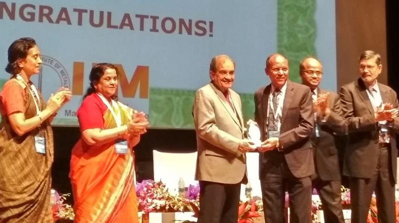RINL-VSPs chairman and managing-director P. Madhusudan receives the National Sustainability Award from Union minister for steel Chaudhury Birender Singh at the 55th National Metallurgists Day programme in BITS Pilani, Goa, on Tuesday.