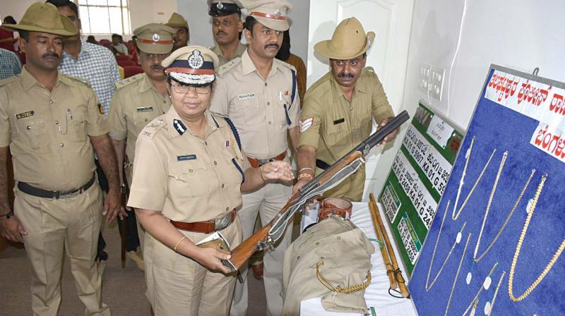 Additional Commissioner of Police (West) Malini Krishnamoorthy with the seized valuables from the fake policemen.