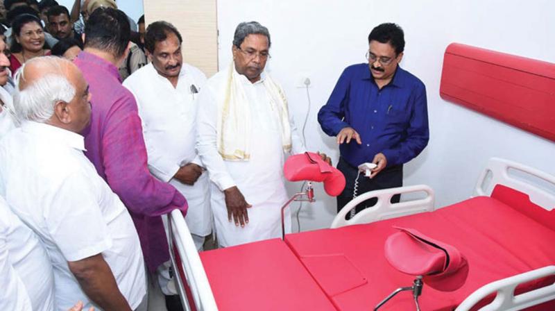Chief Minister Siddaramaiah at the inauguration of a hospital in Udupi on Sunday along with ministers K.J. George and Ramesh Kumar.