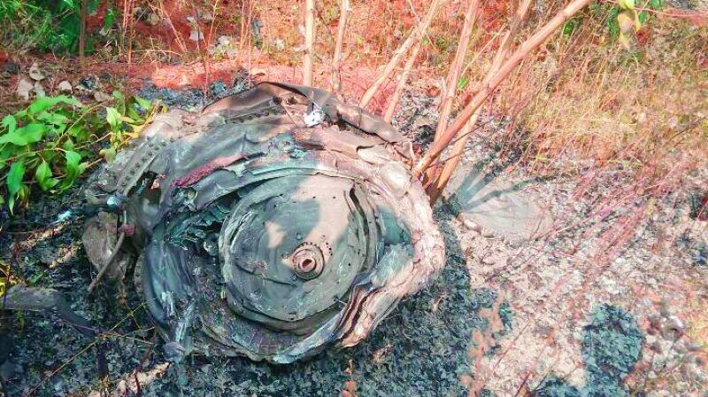 The remains of the Kiran Mark-I aircraft which crashed near the Rajiv Rahadari Highway on Friday.