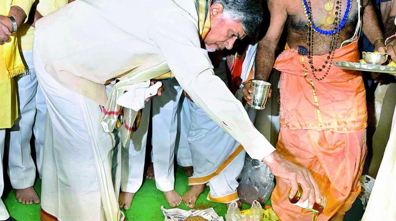 AP Chief Minister N. Chandrababu Naidu performs puja during the foundation stone laying ceremony for the TD central office at Atmakur, Guntur, on Sunday. (Photo: DC