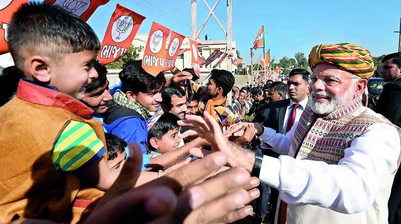 Prime minister Narendra Modi meeting public during his election campaign for the forthcoming Assembly polls in Bhuj, Gujarat, on Monday. (Photo: PTI)