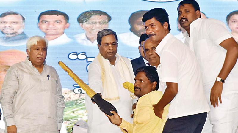 Chief Minister Siddaramaiah and water resources minister H.K. Patil at the launch of developmental works in Nargund in Gadag district on Monday.