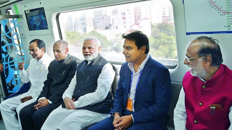 Prime Minister Narendra Modi, Governor E.S.L. Narasimhan, Chief Minister K. Chandrasekhar Rao, Chief Minister K. Chandrasekhar Rao,  and municipal administration minister K.T. Rama Rao during the inaugural metro ride on Tuesday.