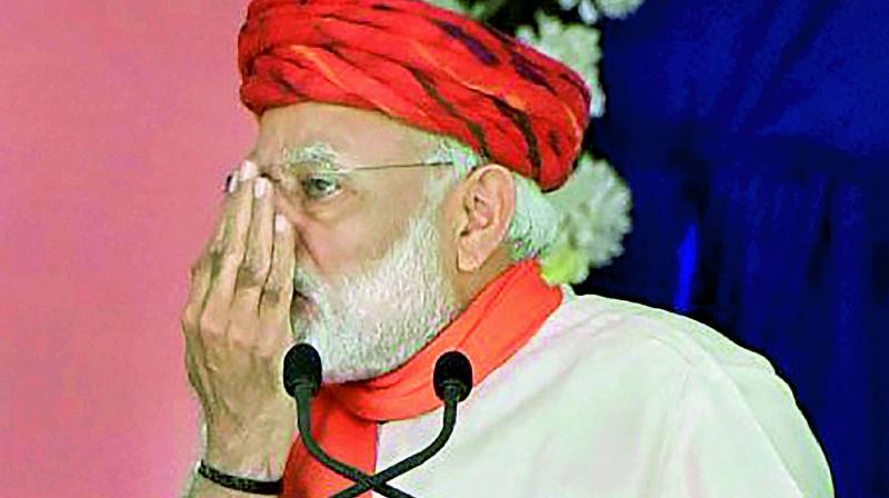 Prime Minister Narendra Modi gestures while addressing an election campaign rally in Morbi on Wednesday. (Photo: PTI)