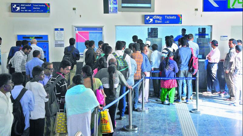 Huge crowd lines up to buy tickets at Nagole Metro station on Wednesday. (Photo: DC)