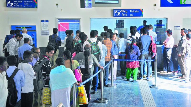 Huge crowd lines up to buy tickets at Nagole Metro station on Wednesday. (Photo: DC)