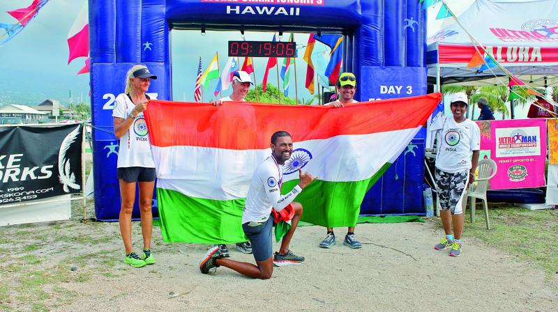 Finishing line: Manmadh poses with the tricolor.