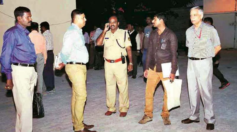 Officials at the site of the blast in Mysuru in August 2016.