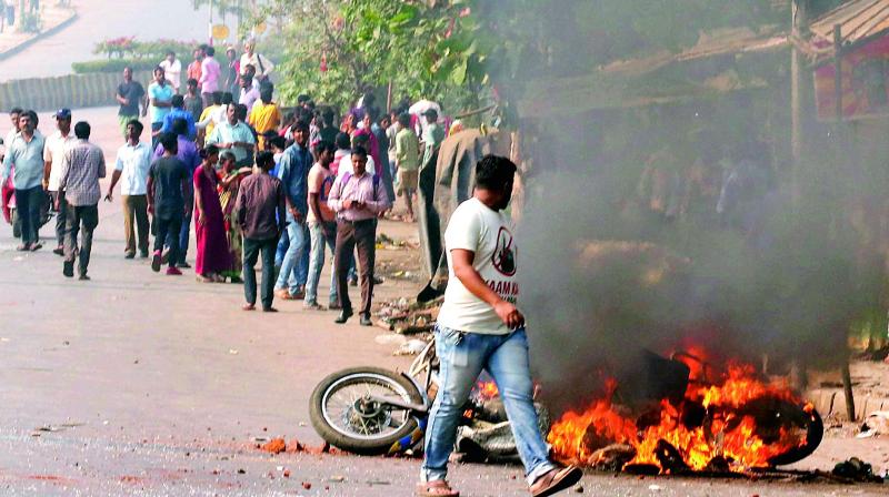 Dalit protesters burn a bike at Vikroli in Mumbai on Wednesday during a protest over Bhima Koregaon violence. (Photo: PTI)