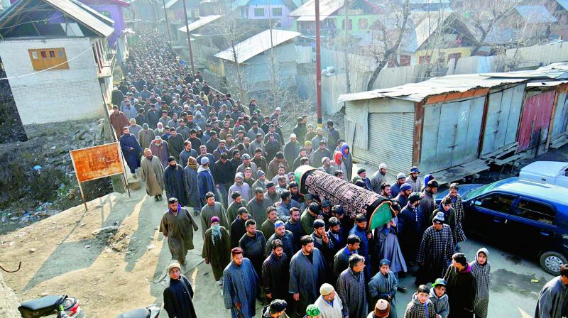 People during the funeral of constable Ghulam Nabi at Rohama in Rafiaabad, who was killed along with three other police personnel in an IED blast at Sopore town in north Kashmirs Baramulla district on Saturday. (Photo: PTI)