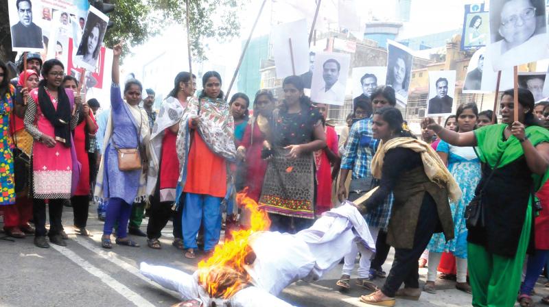 Women members of DYFI burn V.T. Balram in effigy in protest of his statements against Communist leader A.K. Gopalan in front of Secretariat on Tuesday. (Photo: DC)