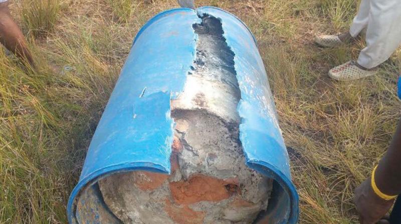 Local fishermen complained on foul smell emanating from the plastic drum. Cops tore it open to find the body sandwiched between the concrete inside on Monday.