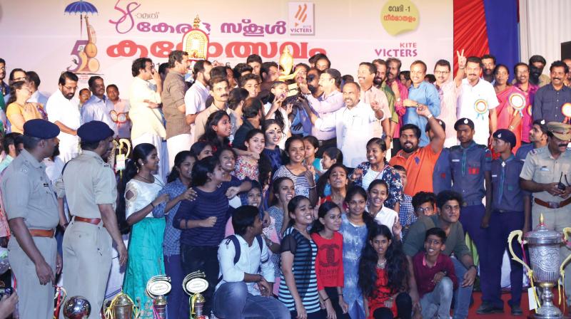 Kozhikode district team exults after winning the Gold Cup at the 58th State School Youth Festival in Thrissur on Wednesday.  (Photo: Photo By Anup. K Venu)