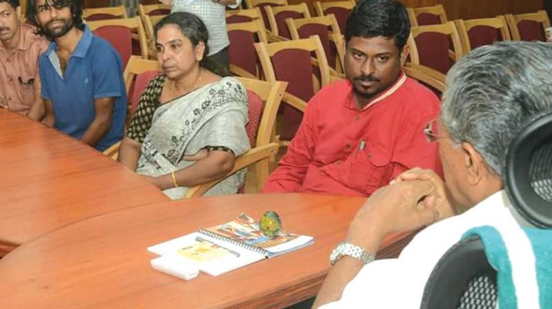 Chief Minister Pinarayi Vijayan meets Sreejith, his  family and friends at his office on Monday.