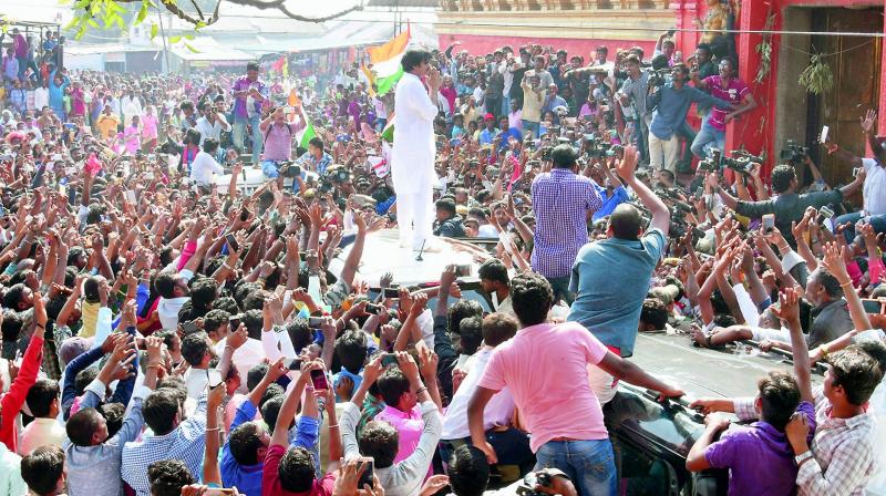 Jana Sena chief Pawan Kalyan greets his fans in front of the Kondagattu Hanuman temple in Jagtial in erstwhile Karimnagar district on Monday. (Photo: DC)