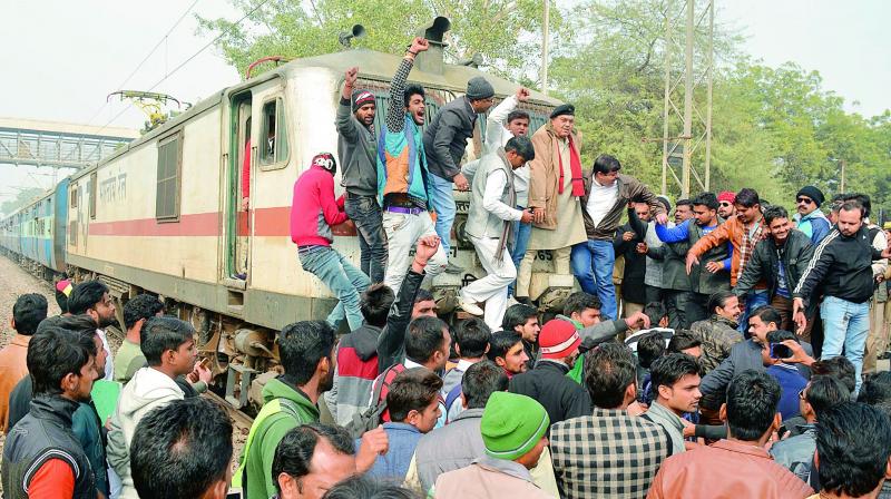 A train was stopped during a protest against the screening of Padmaavat in Mathura, Uttar Pradesh on Wednesday. (Photo: AFP)