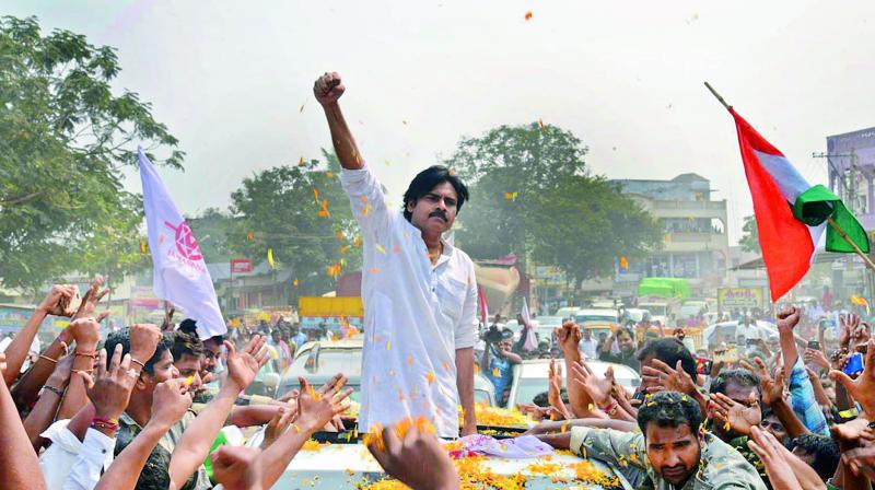 Jana Sena chief Pawan Kalyan raises a clenched fist during his rally in Khammam on Wednesday. (Photo: DC)