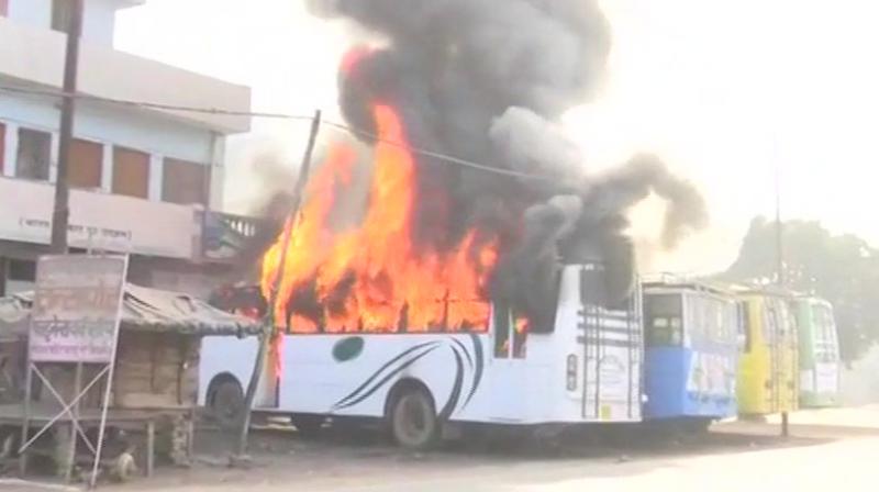 Two buses torched during Kasganj clashes. (Photo: ANI/Twitter)