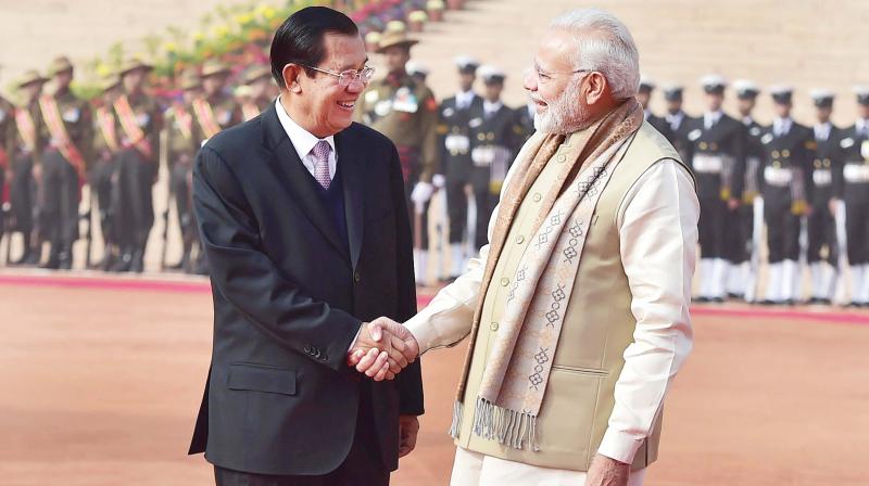 Prime Minister Narendra Modi shakes hands with his Cambodian counterpart Hun Sen during a ceremonial reception at the forecourt of Rashtrapati Bhawan in New Delhi on Saturday. (Photo: PTI)