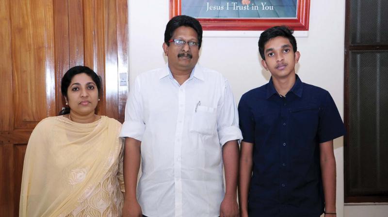 Sabu (centre) with wife Benetta (L) and son Francis (R)