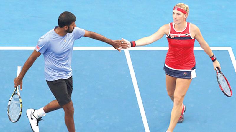 Rohan Bopanna with Timea Babos at the Australian Open mixed doubles finals 2018.