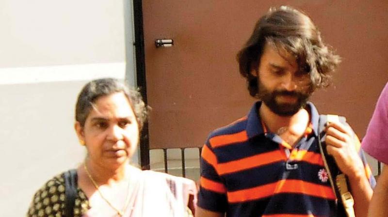 Sreejith and his mother Ramani Prameela arrive at the CBI office to depose on the alleged murder of his brother Sreejeev, during police custody on Wednesday.