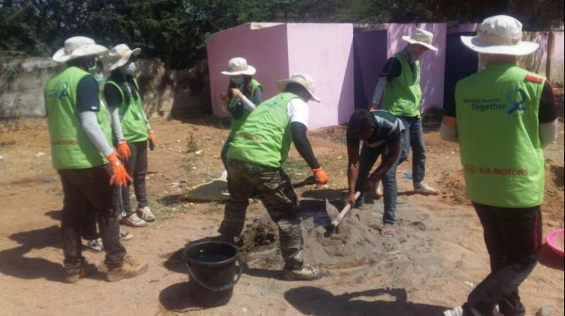 Korean students help in the construction of toilets at Rapthadu ZP High School. 	(Photo: DC)
