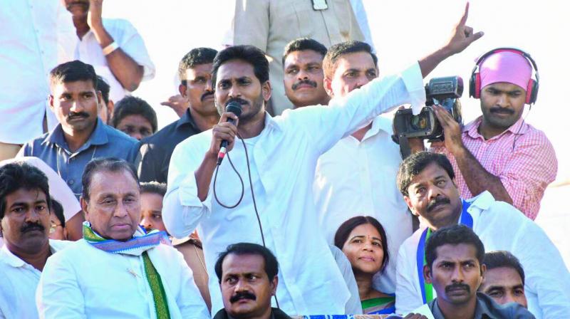 YSRC chief Y.S. Jagan Mohan Reddy addresses people at South Mopuru in Nellore Rural mandal on Saturday. (Photo: DC)