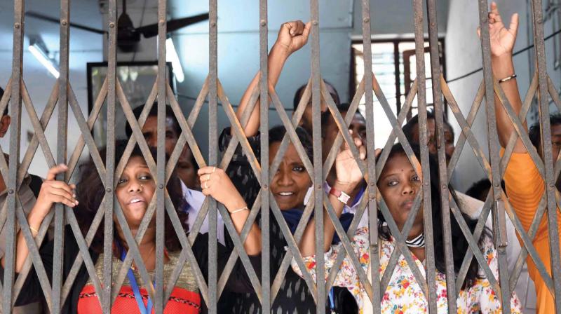 Arrested Dalit activists hold a protest at Puthencruz police station following a tensed situation at Vadayambadi near Kochi on Sunday. (Photo: DC)