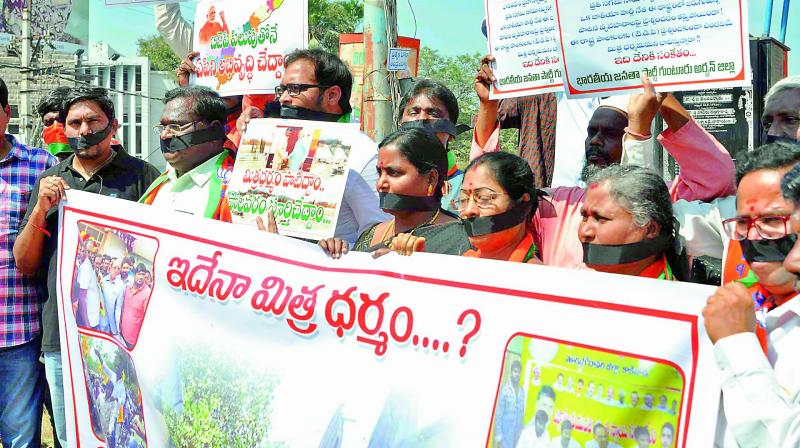 BJP activists take part in a protest against attack on MLC  S. Veearaju in  Guntur on Tuesday.  (Photo: DC)