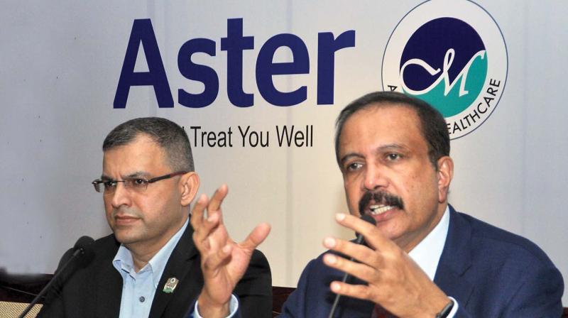 Aster DM Healthcare chairman Azad Moopen announces the IPO of the company along with Aster Medcity CEO Dr Harish Pillai in Kochi on Wednesday. (Photo: SUNOJ NINAN MATHEW)