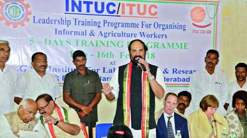 TPCC president N. Uttam Kumar Reddy speaks on MGNREGA issue at INTUC office in Hyderabad. G. Sanjeev Reddy, R.C. Khuntia and foreign deligates are also seen. (Photo: P. Anil Kumar )