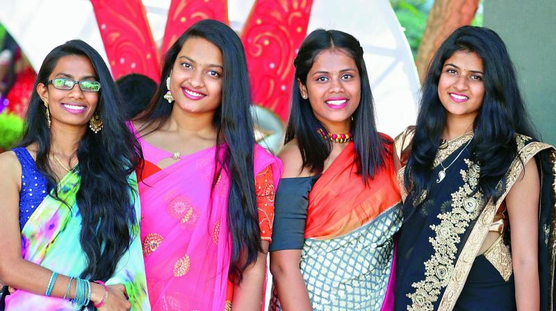 These young girls turned heads in saris.