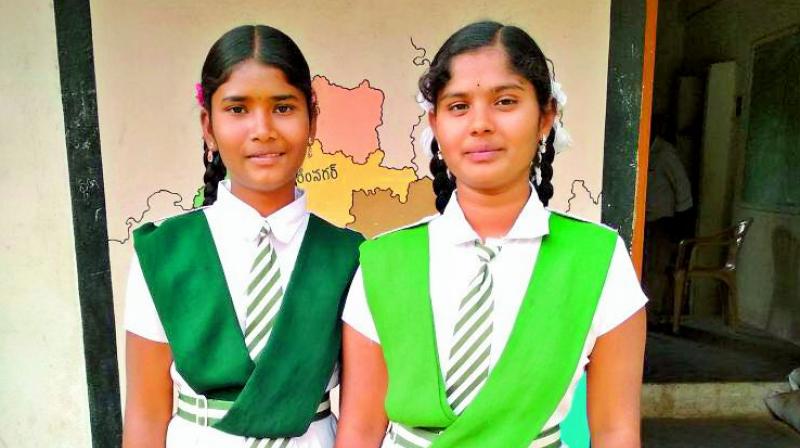 Dynamic duo: Algote Vaishnavi and Rashmita Mothkuri infront of their school.