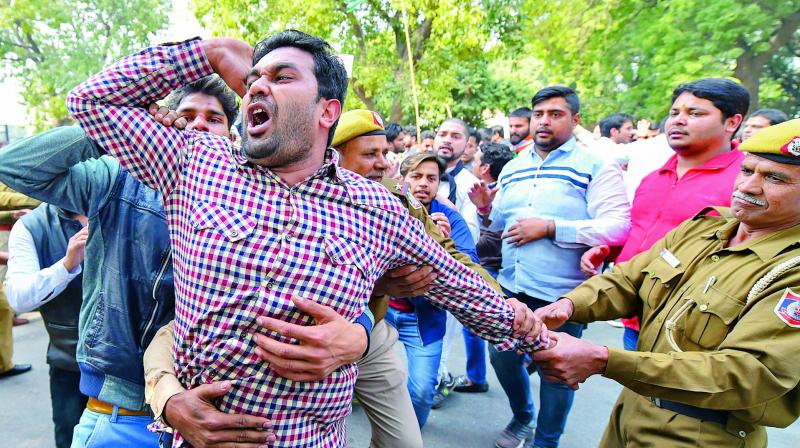 Indian Youth Congress activists raise slogans against Nirav Modi in relation to Punjab National Bank fraud case in New Delhi on Friday. (Photo: PTI)