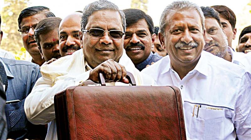 Chief Minister Siddaramaiah arrives at Vidhana Soudha to present his 13th State Budget in Bengaluru on Friday. (Photo: DC)