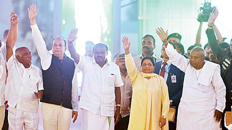 State JD(S) president H.D. Kumaraswamy, BSP chief Mayawati and JD(S) patriarch Deve Gowda at the JD(S)-BSP rally in Bengaluru on Saturday. (Photo: DC)