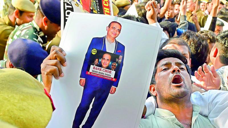 Indian Youth Congress activists raise slogans as they protest against Nirav Modi in the Punjab National Bank fraud case in New Delhi on Wednesday. (Photo: PTI)